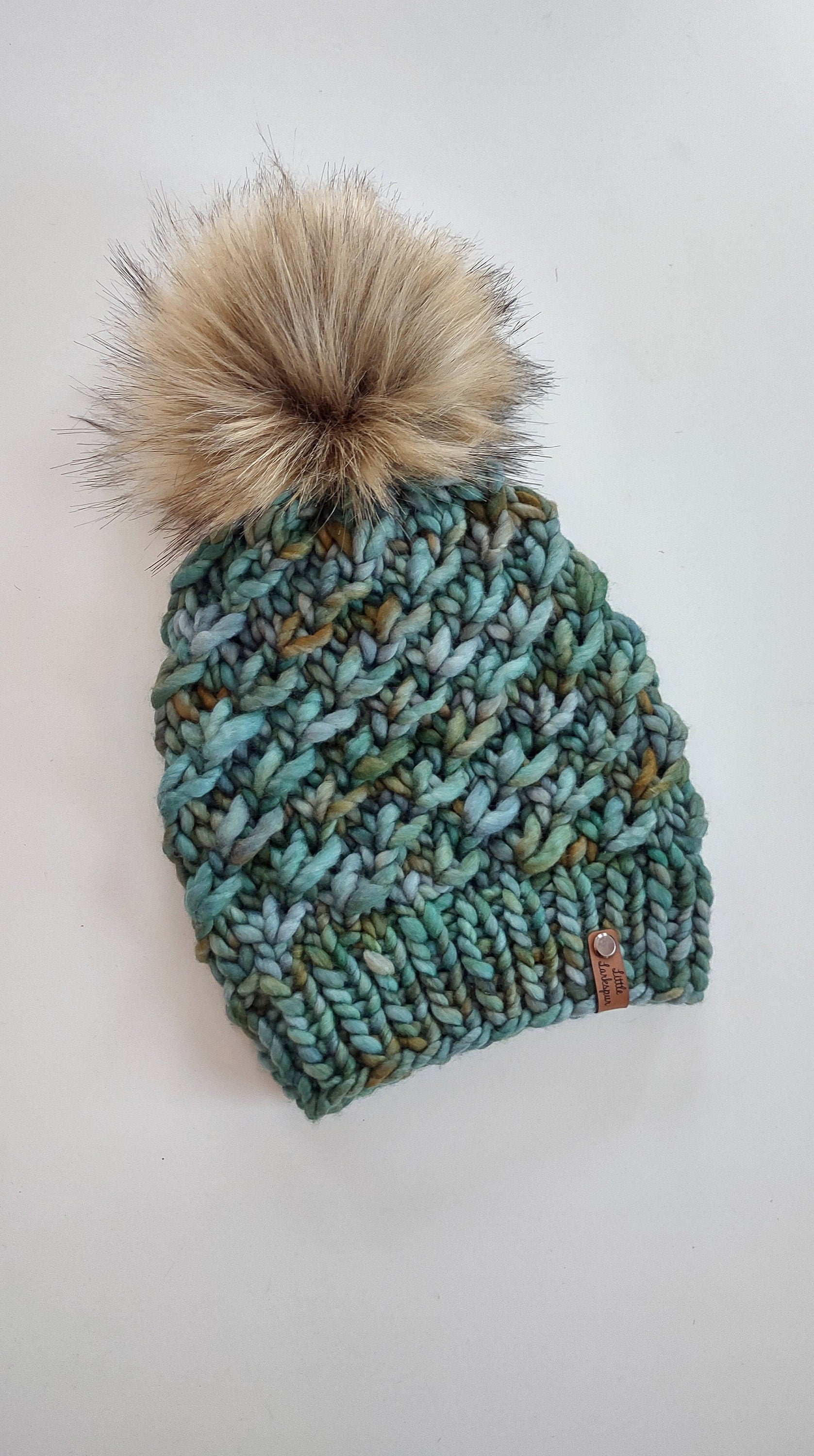 Luxury Adult Merino Wool Hand Knit Hat. Crush Hat. Soft hand knitted hat. Malabrigo Rasta. Greens & blues beanie with faux fur pom pom.